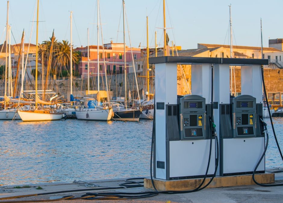 Fuel pumps on a marina quay with yachts moored in the background Fuel Mismanagement at Marinas